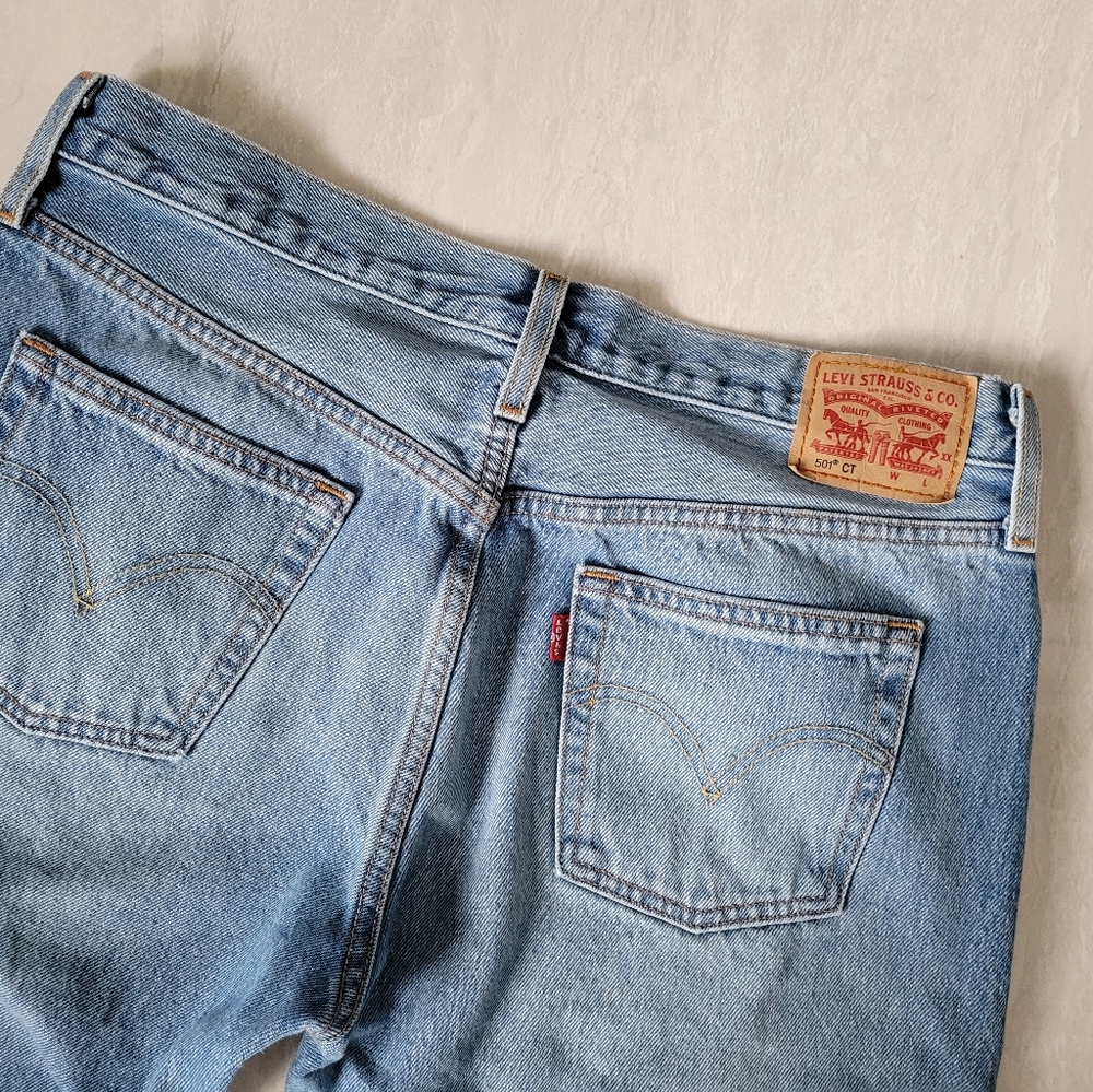 LEVIS 501 jeans blue with distressed detail on knees button fly